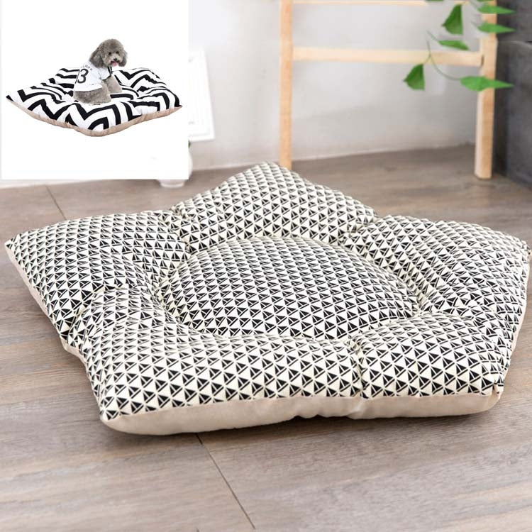 Dog sleeping mat bed with black-and-white geometric triangle pattern and cream base