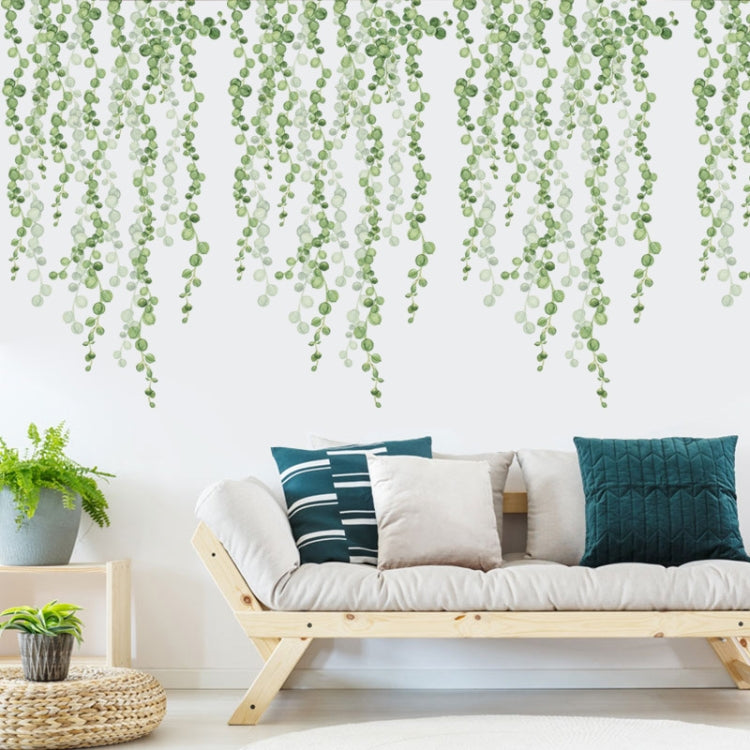 Green leaf dangling wall stickers spreading across a wall like hanging vine curtain