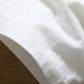 White cotton-linen five-point shorts fabric close-up with soft textured weave