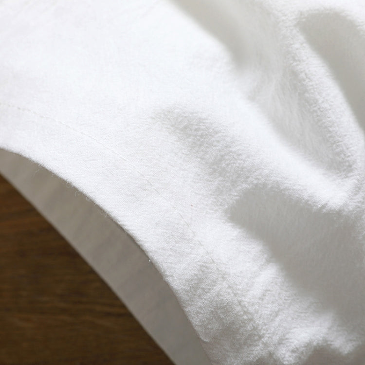 White cotton-linen five-point shorts fabric close-up with soft textured weave