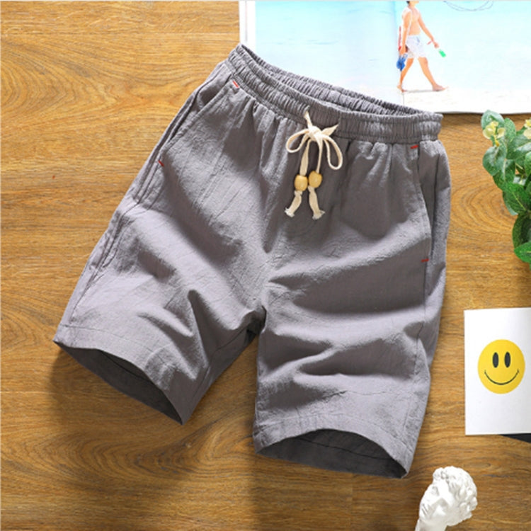 Gray cotton-linen five-point shorts with elastic waist and tan drawstring knots