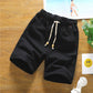 Black cotton-linen five-point shorts with elastic waistband and drawstring, relaxed fit