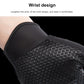 Black cycling glove close-up: elastic wrist cuff with textured hex-pattern grip fabric.