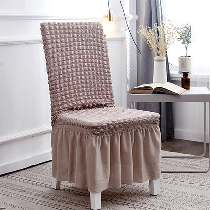 Universal chair cover with bubble-textured fabric, elastic wrap, chair with skirt in taupe