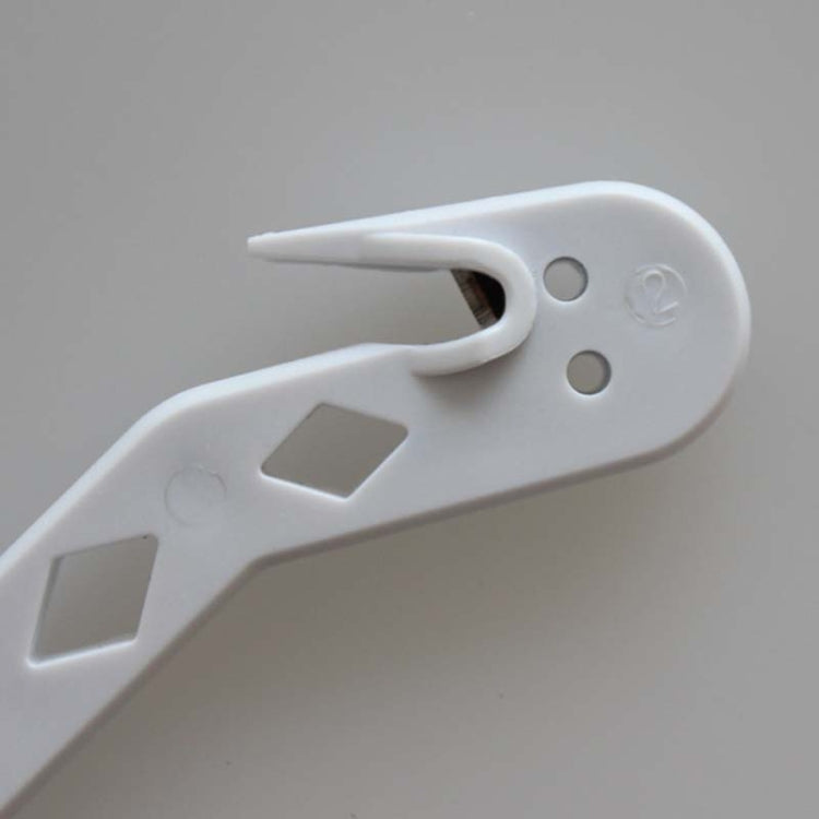 White small cleaning brush with angled nozzle and mounting clip detail