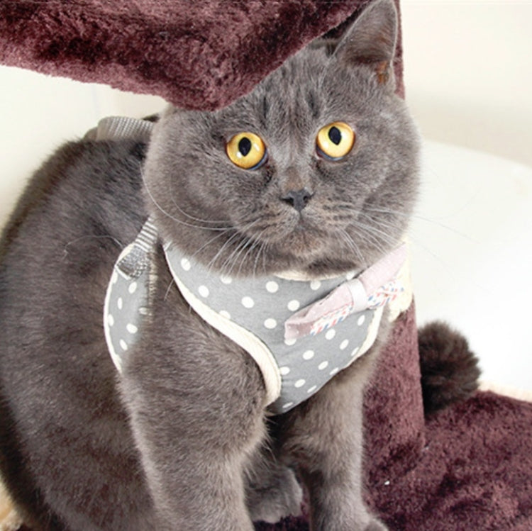 Gray polka-dot dog chest harness vest with white trim and snap closures