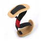 Bunion corrector toe spacer with beige pads, black straps, and red accent
