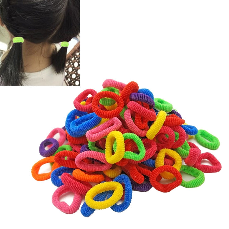 Child rubber hair bands, two green loop ties attached to a ponytail