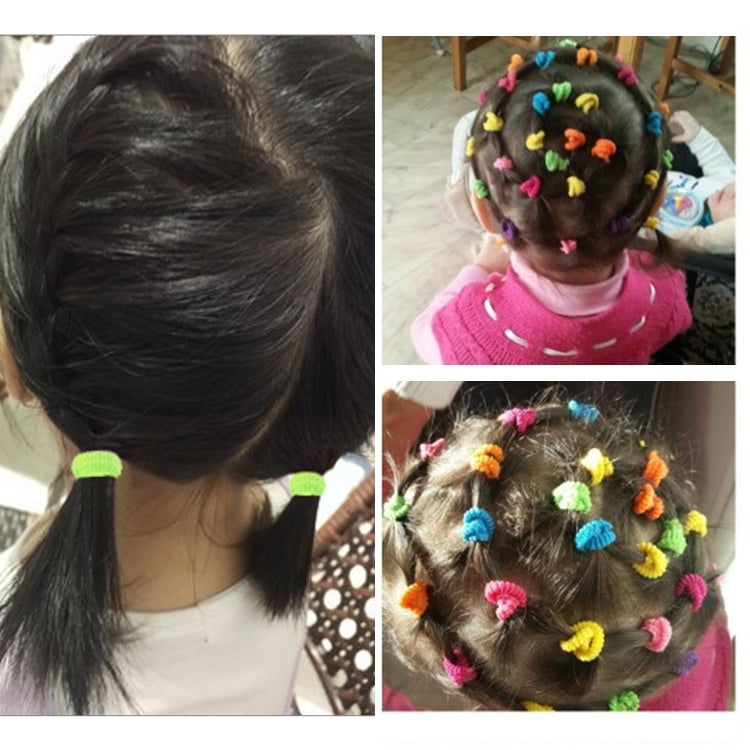 Child hair rubber bands set, green loop ties on ponytail and multicolor in hair