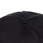 Black dad hat crown close-up with stitched seams and round top button