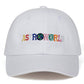White dad hat front view with colorful ASTROWORLD embroidery and stitched crown