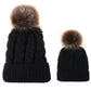Parent-child knit beanie set in black with brown faux-fur pom pom tops