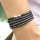 Dark brown braided leather wrap bracelet with silver-tone bar clasp