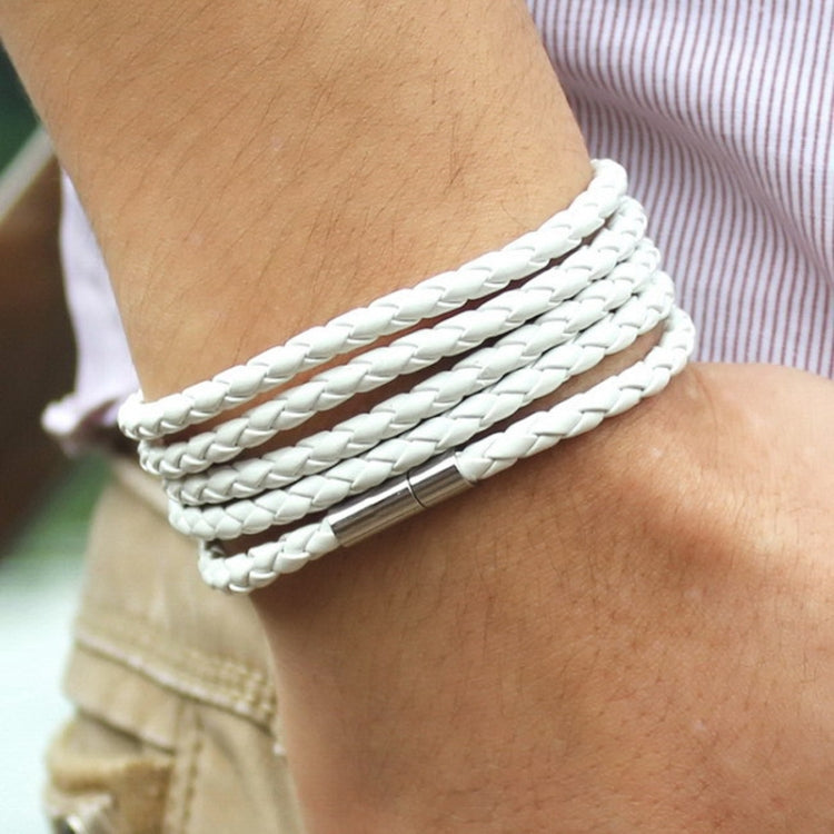 White braided leather wrap bracelet with silver-tone bar clasp on wrist
