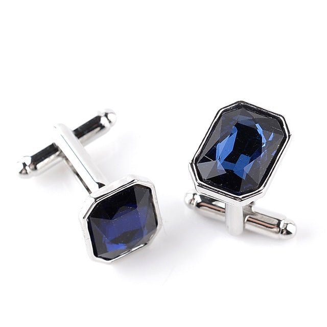 Silver-tone French cufflinks with deep blue octagon zircon stones, hinged bar backs.