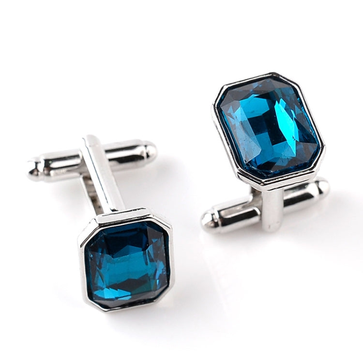 Silver-tone French cufflinks with bright blue octagon zircon stones, hinged bar backs.