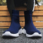 Blue knit sock sneakers with ribbed cuffs and white cushioned sole