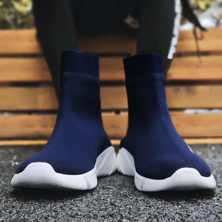 Blue knit sock sneakers with ribbed cuffs and white cushioned sole