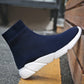 Navy knit sock sneaker boot with ribbed cuff and thick white sole