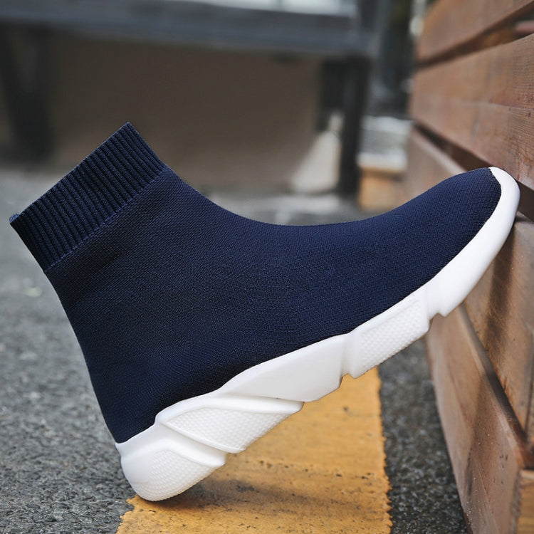 Navy knit sock sneaker boot with ribbed cuff and thick white sole