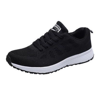 Women's black mesh lace-up running sneakers with white cushioned sole