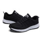 Women's black mesh lace-up running sneakers, angled side-by-side with white sole