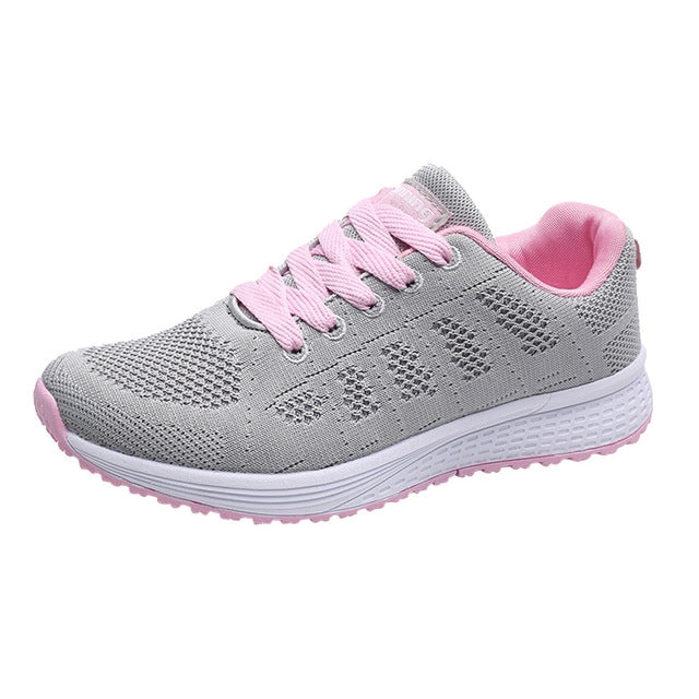 Women's gray mesh lace-up running sneakers with pink laces and white sole
