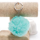 Light teal faux rabbit fur pompon keychain with silver metal key ring and chain