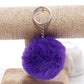 Purple faux rabbit fur pompon keychain with silver key ring and chain
