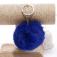 Royal blue faux rabbit fur pompon keychain with silver key ring and chain