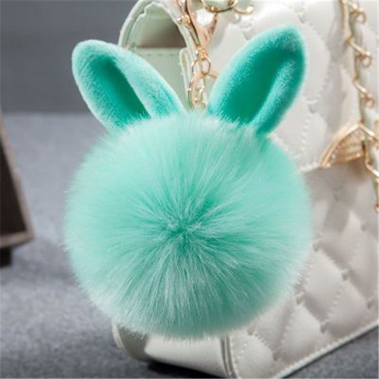 Turquoise faux-fur rabbit pom keychain with long ears and gold-tone clasp