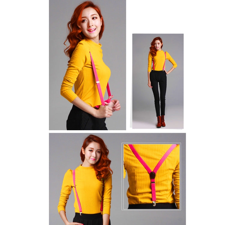 Yellow stretch-knit top with pink adjustable shoulder strap clips at the chest