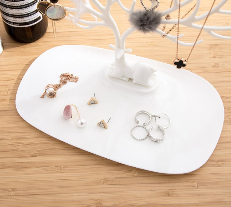 White antler jewelry display tray with rings, earrings, and necklace hooks on base