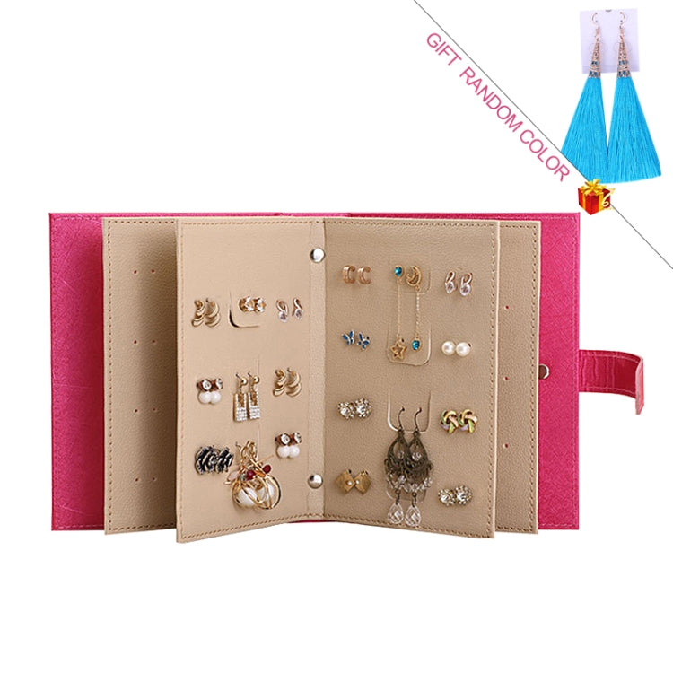 Rose red jewelry storage box organizer with open compartments and multiple earrings
