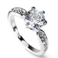 White gold round crystal six-claw ring with bright center stone and prong settings