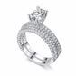 Double-row cubic zirconia ring set in silver tone with round crystal center
