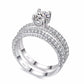 Cubic zirconia wedding ring set with double-row pavé band and round solitaire