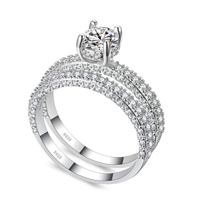 Silver-tone double-row cubic zirconia ring set with round center stone