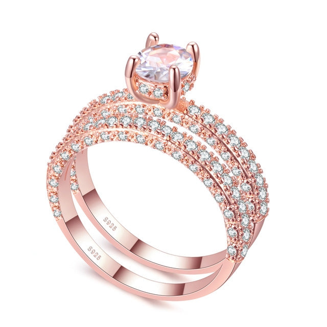 Rose gold double-row cubic zirconia wedding ring with round center stone