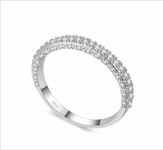 Silver-toned double-row cubic zirconia wedding band viewed from the side