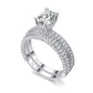 White double-row cubic zirconia wedding ring with large round center stone, halo style