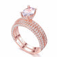 Rose gold double-row cubic zirconia engagement ring with oval center stone