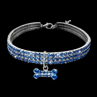 Blue rhinestone dog collar with silver buckle and hanging crystal bone charm for small dogs