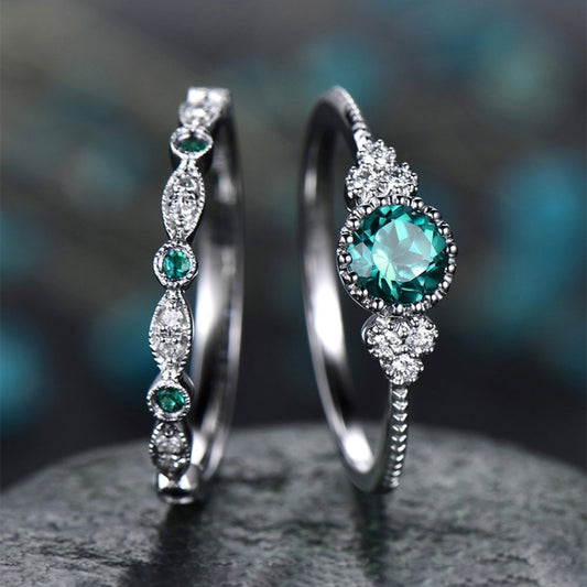 2-piece zircon gemstone ring set with one teal stone ring and one slim pavé ring