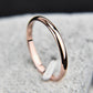 Rose gold and black two-tone stainless steel ring with smooth polished band