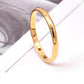 Polished gold stainless steel ring with smooth rounded band