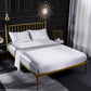 Light gray satin-look four-piece bedding set with pillowcases and fitted sheet on bed