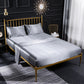 Silver gray satin-look four-piece bedding set with pillowcases and fitted sheet on bed