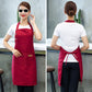 Red kitchen apron in back view, tied waist and adjustable neck strap.