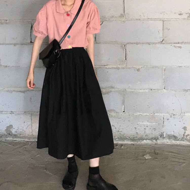 Black high-waist A-line midi skirt with loose drape and flare
